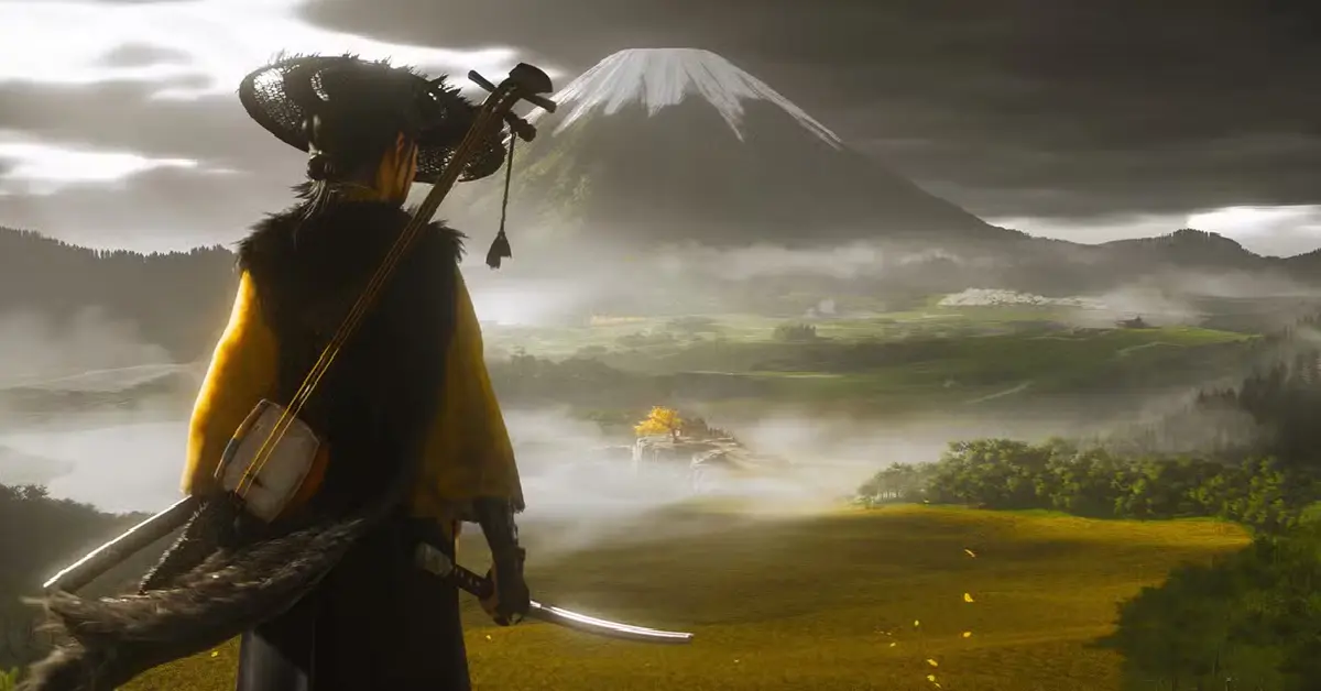 Ghost of Yōtei hoofdrolspeler Atsu staat in een veld met hoog gras en kijkt naar Mount Yōtei